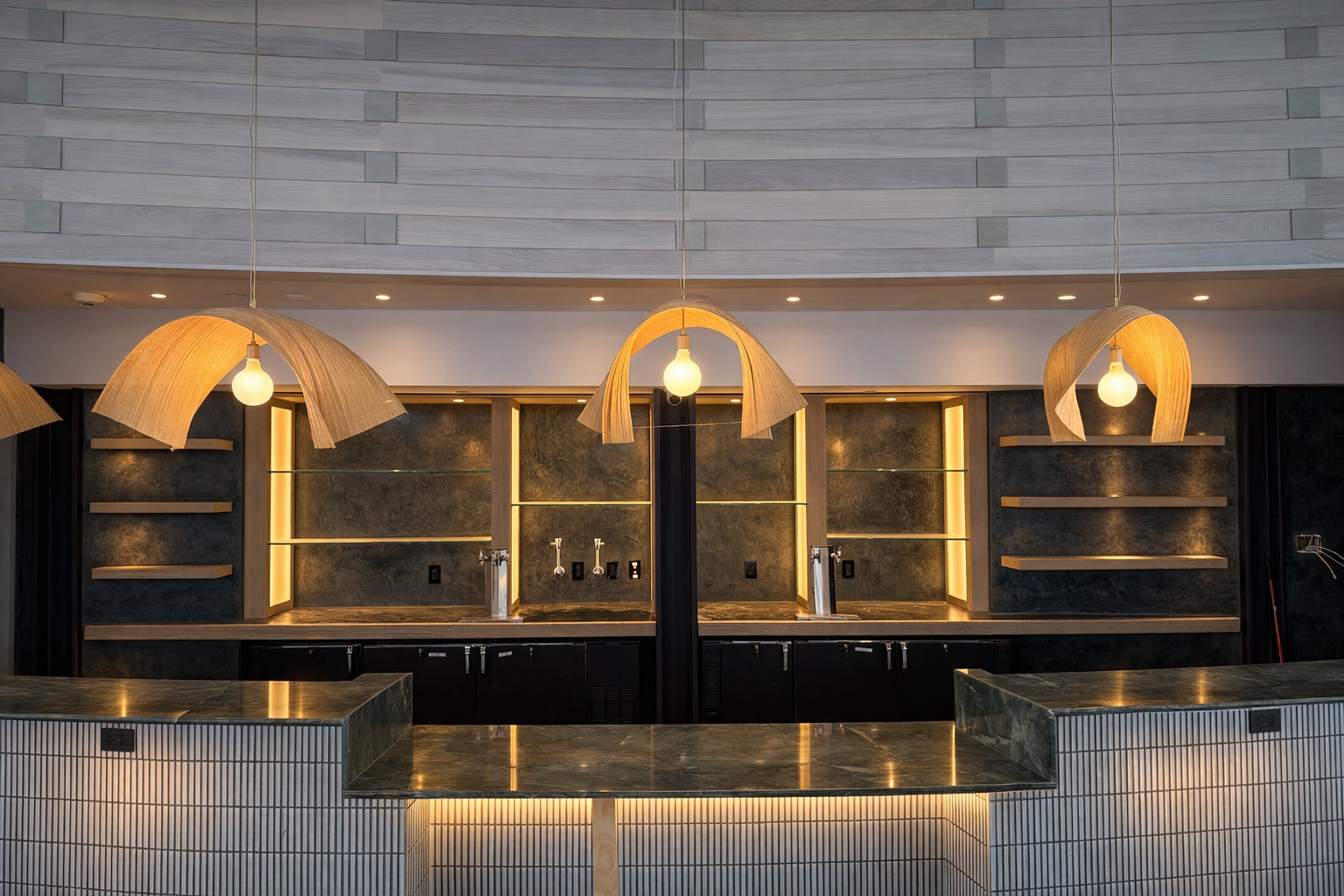 Metallic plaster panels behind the bar.