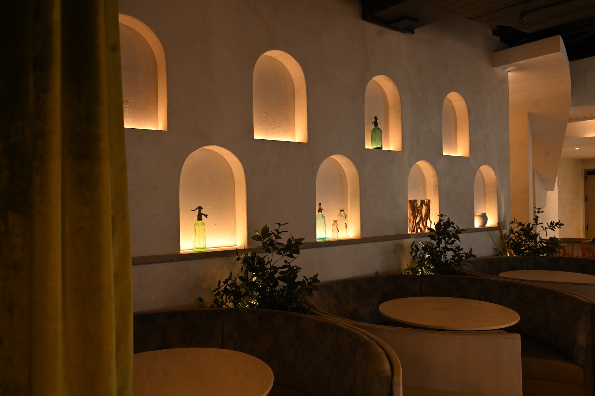 Arched plaster niches with concealed lighting.